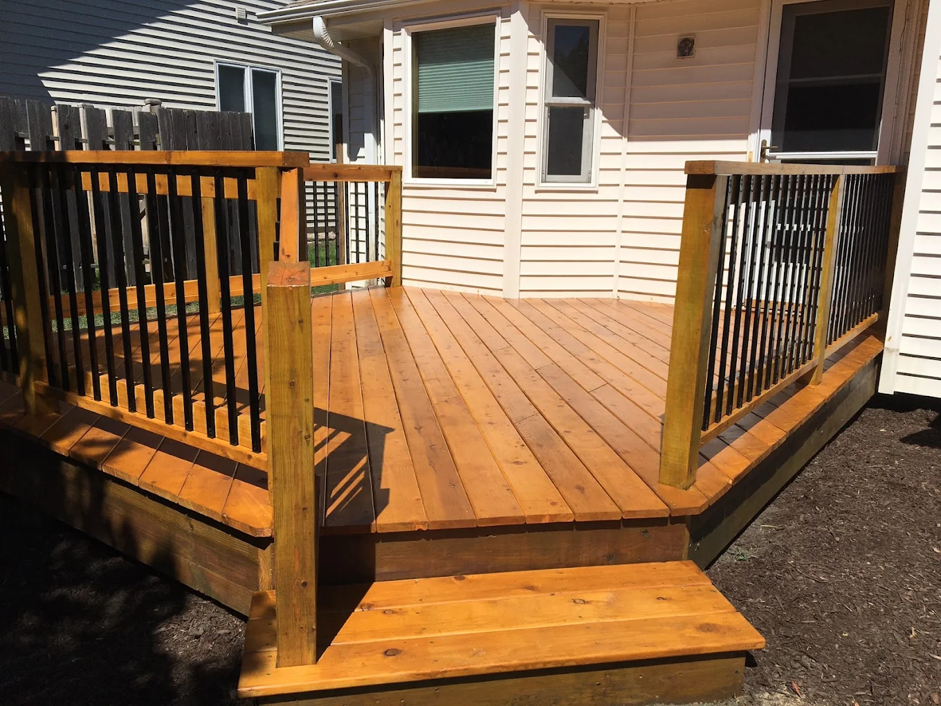 Cedar deck construction in Kenosha, WI - landscaping cost guide